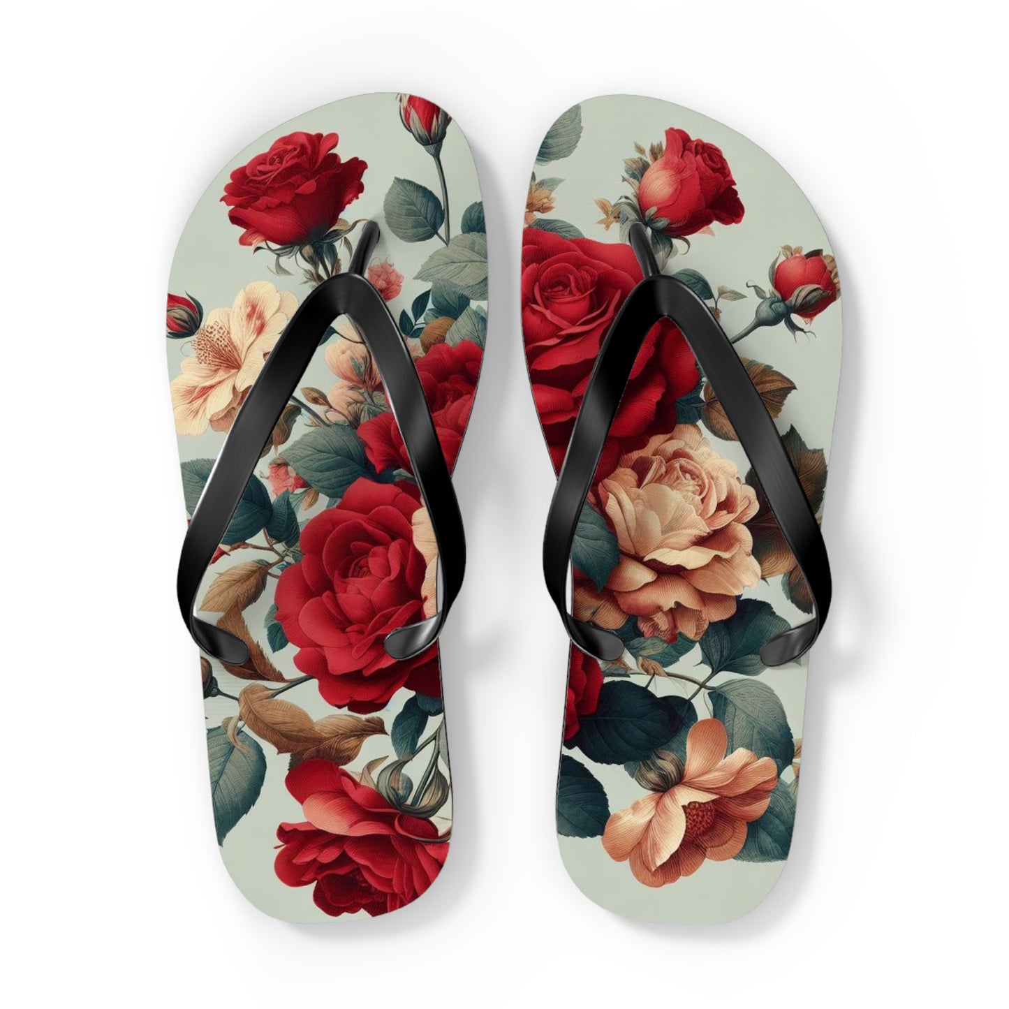 a pair of floral flip flops on a white background